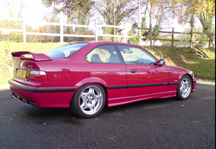 A blue car driving on a road

AI-generated content may be incorrect.