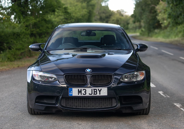 A black car on a road

AI-generated content may be incorrect.