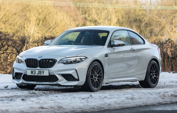 A white car parked on a snowy road
AI-generated content may be incorrect.