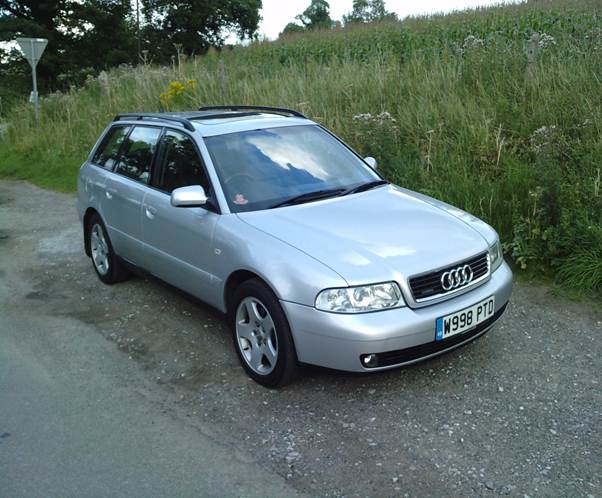 A silver car parked on a road
AI-generated content may be incorrect.