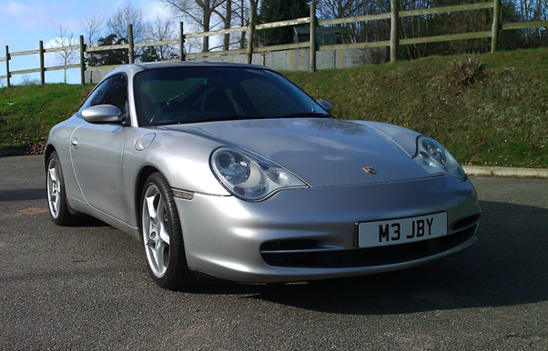 A silver car parked on the side of a road
AI-generated content may be incorrect.