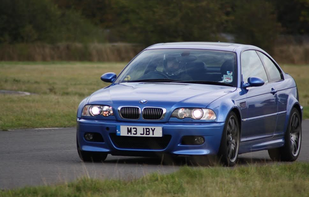 A blue car driving on a road
AI-generated content may be incorrect.