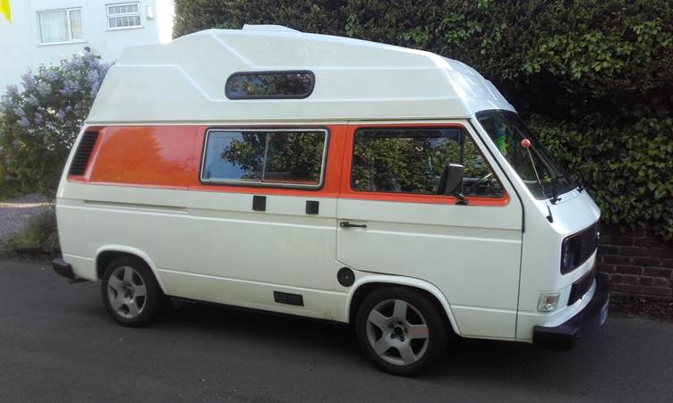 A white and orange camper van

AI-generated content may be incorrect.